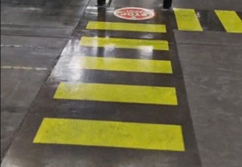 Projected pedestrian crossing in warehouse